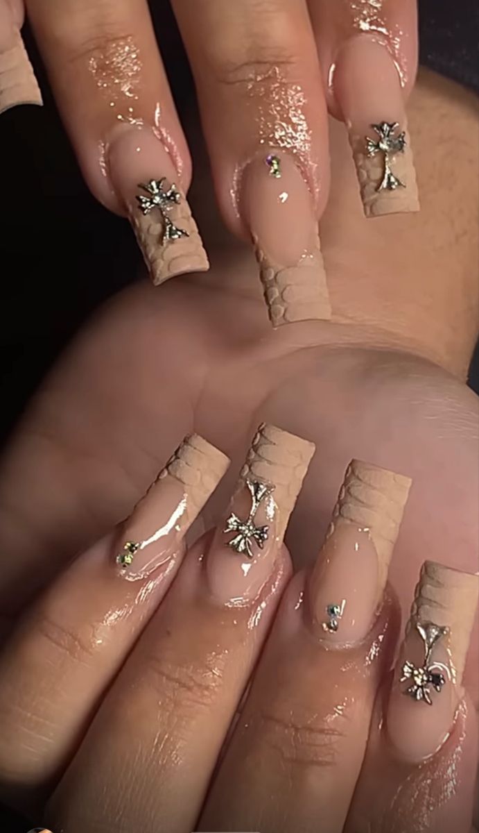 Chic Nude Square Acrylic Nails with Textured Patterns and Elegant Embellishments.