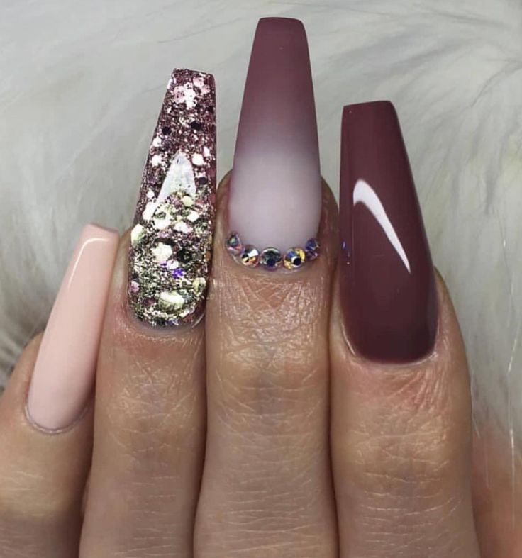 Sophisticated Nail Design with Textured Pastels, Glossy Burgundy, Ombre Effect, and Glamorous Rhinestones.