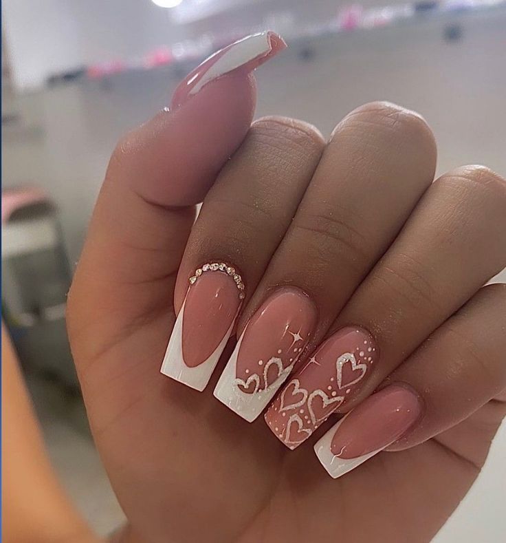 Chic Soft Pink Ombre Acrylic Nails with White Tips and Elegant Accents.