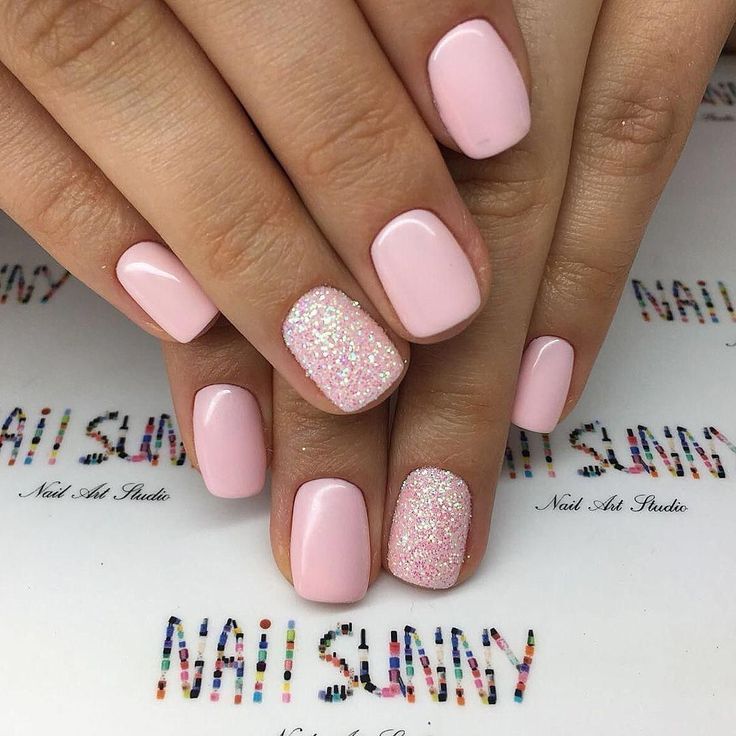 Chic Soft Pink Nail Design: Glossy Base with Glitter Accent for Elegant Playfulness.