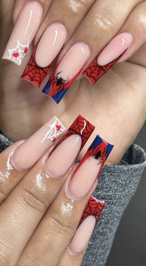 Bold Spider-Themed Nail Design: Striking Red, Blue, and Clear Elements with Intricate Patterns for a Spooky Halloween Look.