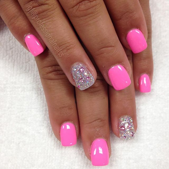 Playful Elegance: Vibrant Pink Manicure with Glitter Accents