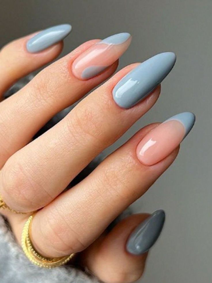 Chic Muted Nail Design: Elegant Blue-Pink Contrast with Edgy Almond Tips.