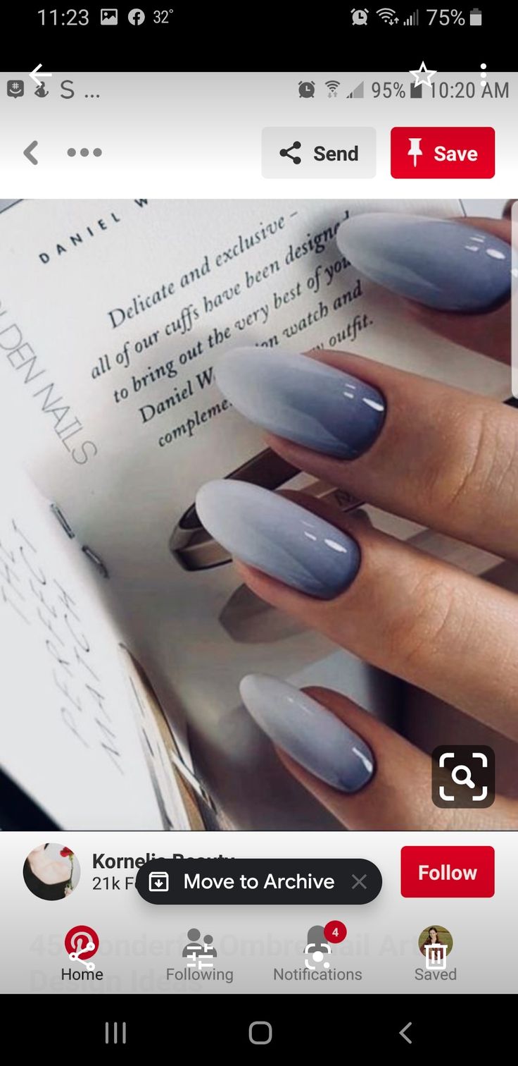 Sophisticated Ombre Nail Design: Elegant White to Deep Gray Gradient in Almond Shape.