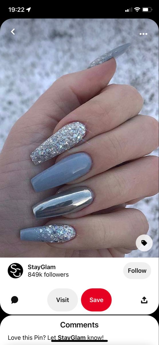 Elegant Blue and Silver Nail Design with Glitter and Metallic Accents for a Subtle Glamorous Touch.