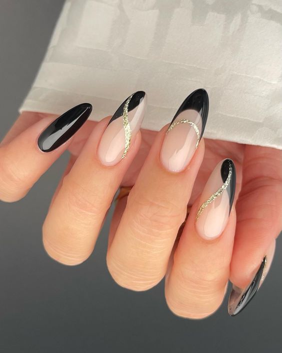 Sophisticated Black and Nude Nail Design with Gold Accents