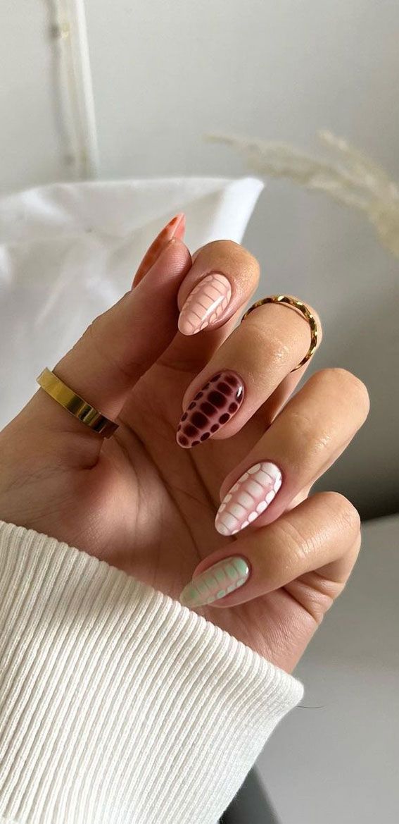 Striking Unique Nail Design: A Cohesive Blend of Textures and Colors