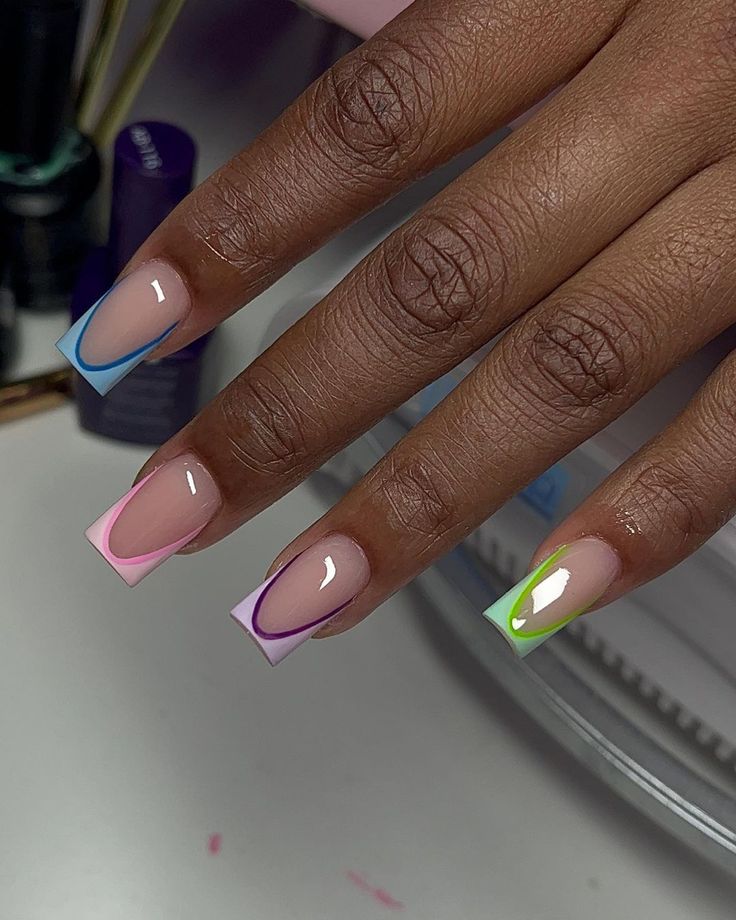 Playful Pastel French Manicure with Vibrant Geometric Accents