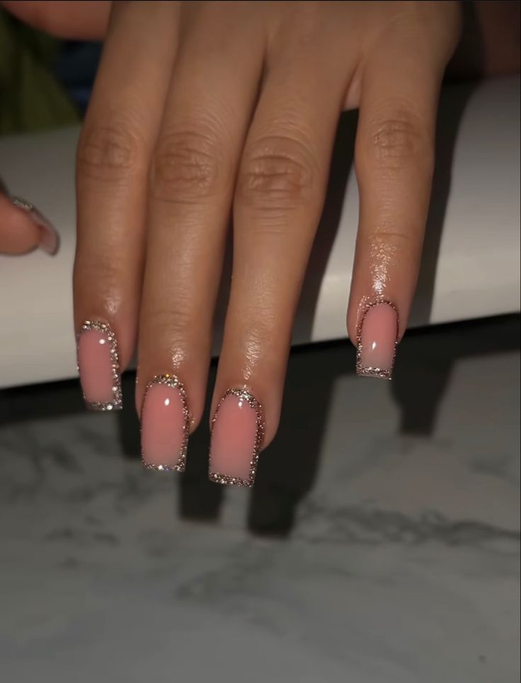 Chic Soft Pink and Shimmering Silver Square Nail Design with Subtle Embellishments.