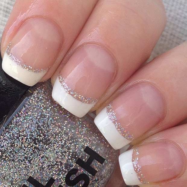 Chic Elegant French Tips Enhanced with Subtle Glitter Accents.