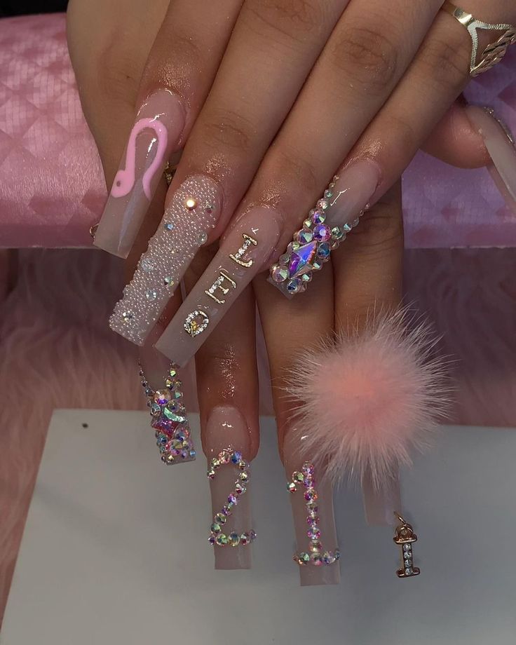 Trendy Long Sculpted Nail Design with Playful Embellishments and Pastel Colors.