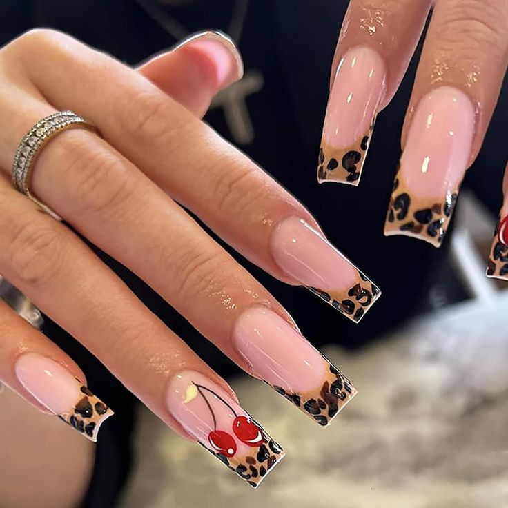 Charming Leopard Print Nail Design with Glossy Cherry Accents for a Bold, Stylish Look.