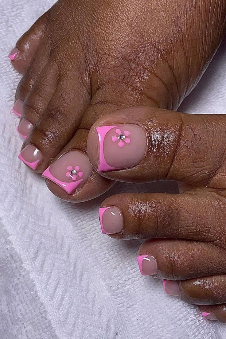 Charming Floral-Inspired Pedicure Design in Soft Pink and Nude Tones.