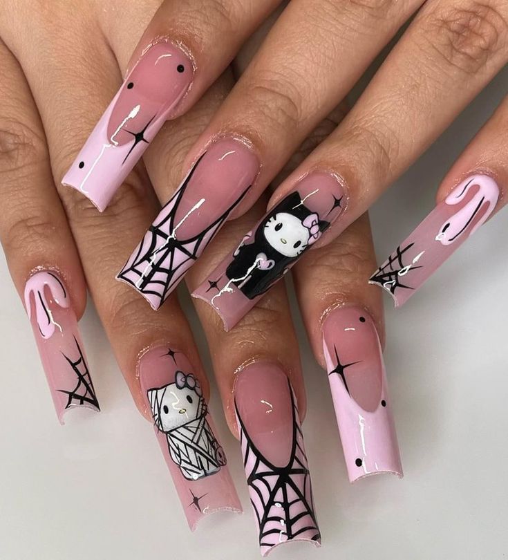 Playful Halloween Nail Art with Pink Backdrop and Intricate Spiderweb Designs