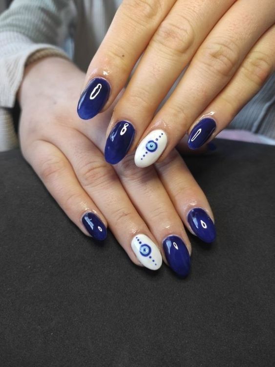 Modern Elegant Nail Design: Deep Navy Blue and Crisp White with a Touch of Tradition.