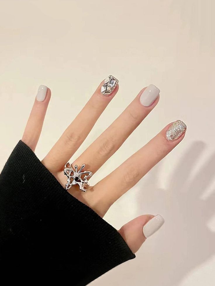 Chic Nail Design: Subtle Shimmer with Geometric Accent and Sparkling Glitter