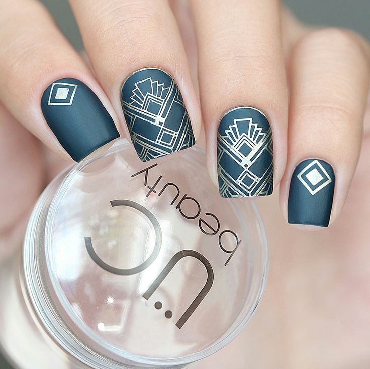 Elegant Deep Teal Nail Design with Geometric Patterns and Silver Accents