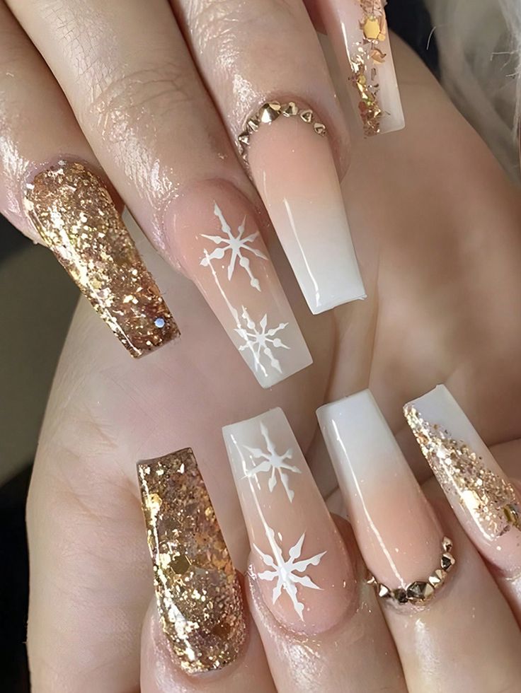 Chic Winter Nail Design: Beige Ombre with Sparkling Gold and Snowflake Accents