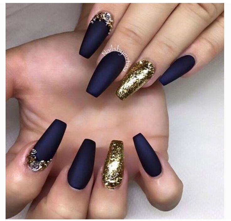 Luxurious Nail Design: Deep Matte Navy Meets Vibrant Gold Glitter.