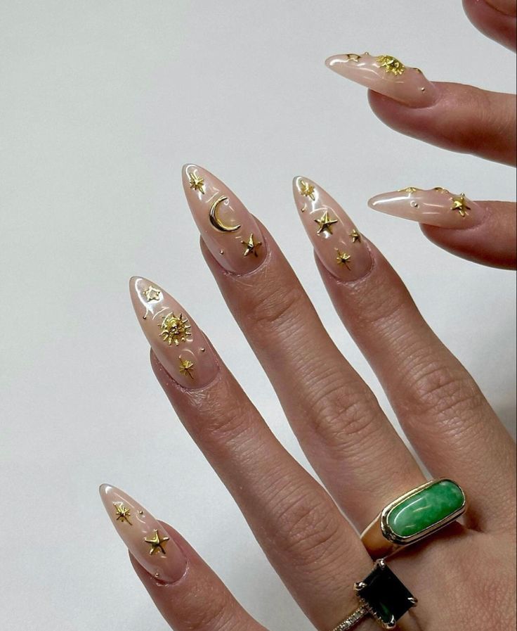 Celestial-Inspired Almond-Shaped Nails: Whimsical Elegance with Gold Accents.