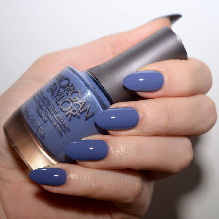 Sophisticated Almond-Shaped Blue Manicure with Glossy Finish for Any Occasion.