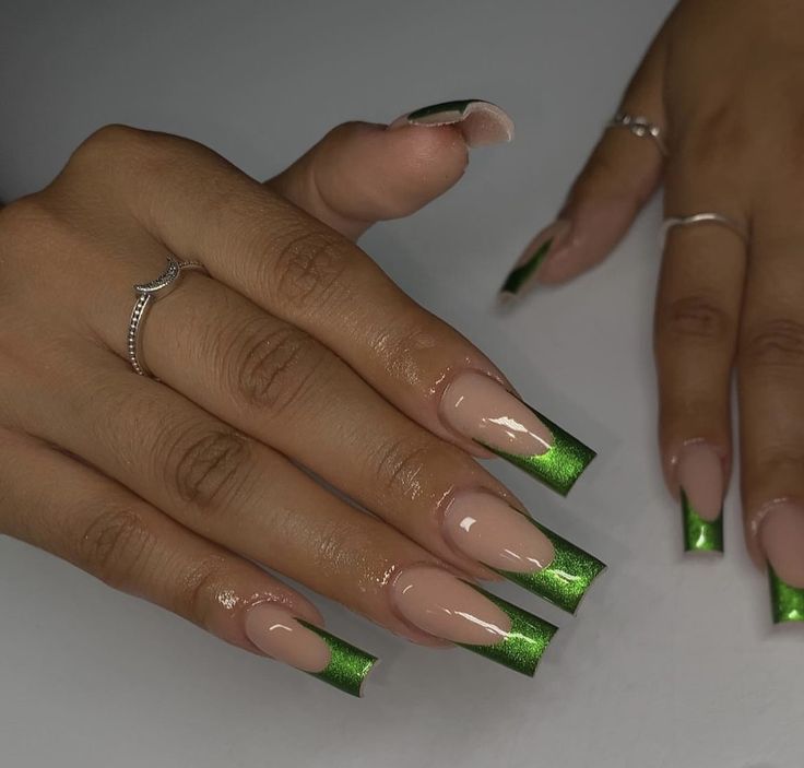 Chic French Tip Manicure with Shimmering Green and Nude Colors