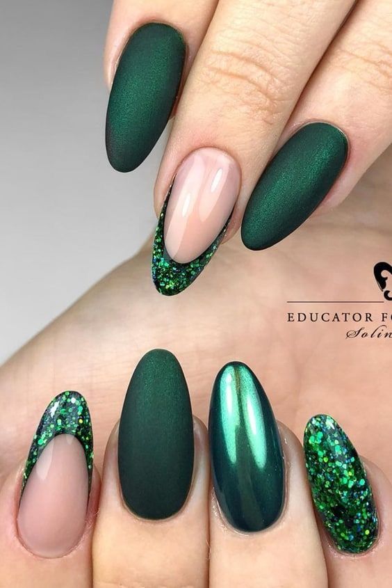 Elegant Deep Green Matte Nail Design with Glitter Accents for a Chic Look.