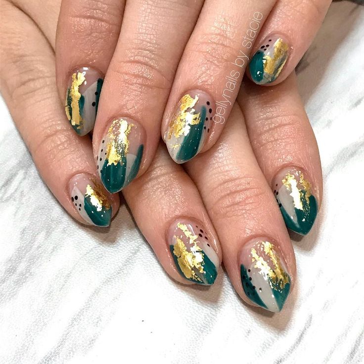 Sophisticated Nail Design: Deep Teal and Soft Beige with Gold Leaf Accents