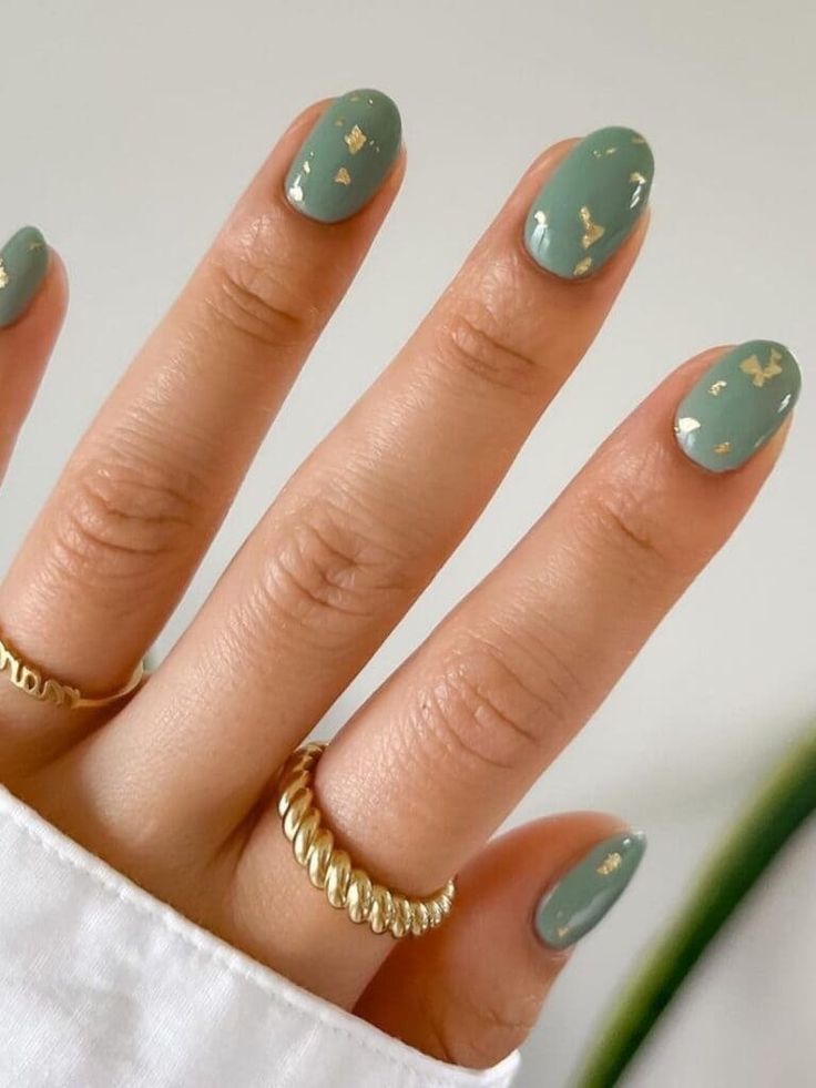 Sophisticated Green Nail Design with Gold Accents