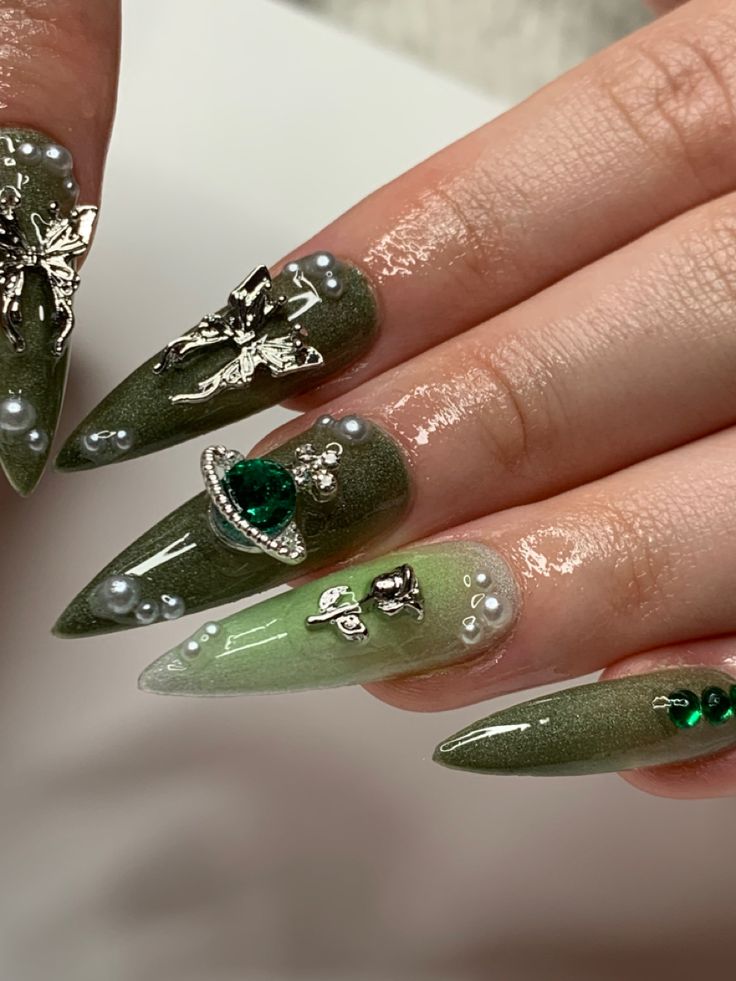 Sophisticated Elegant Green Nail Design with Intricate Embellishments and Almond Shape