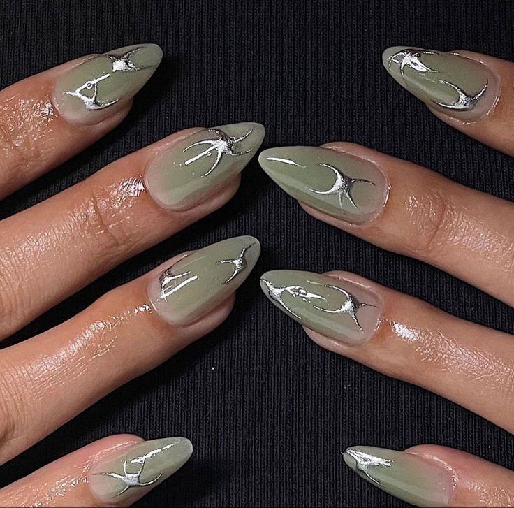 Elegant Soft Green Nail Design with Artistic Silver Lines in Almond Shape