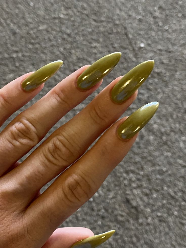 Elegant Glossy Olive Green Almond-Shaped Nails: A Modern Accessory for Any Outfit.