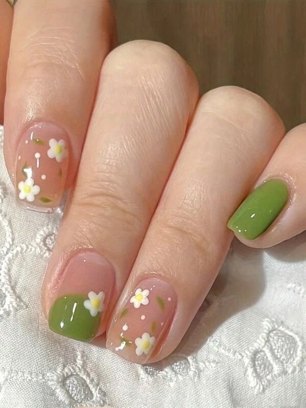 Spring-Inspired Floral Nail Design with Pink Base and Green Accents