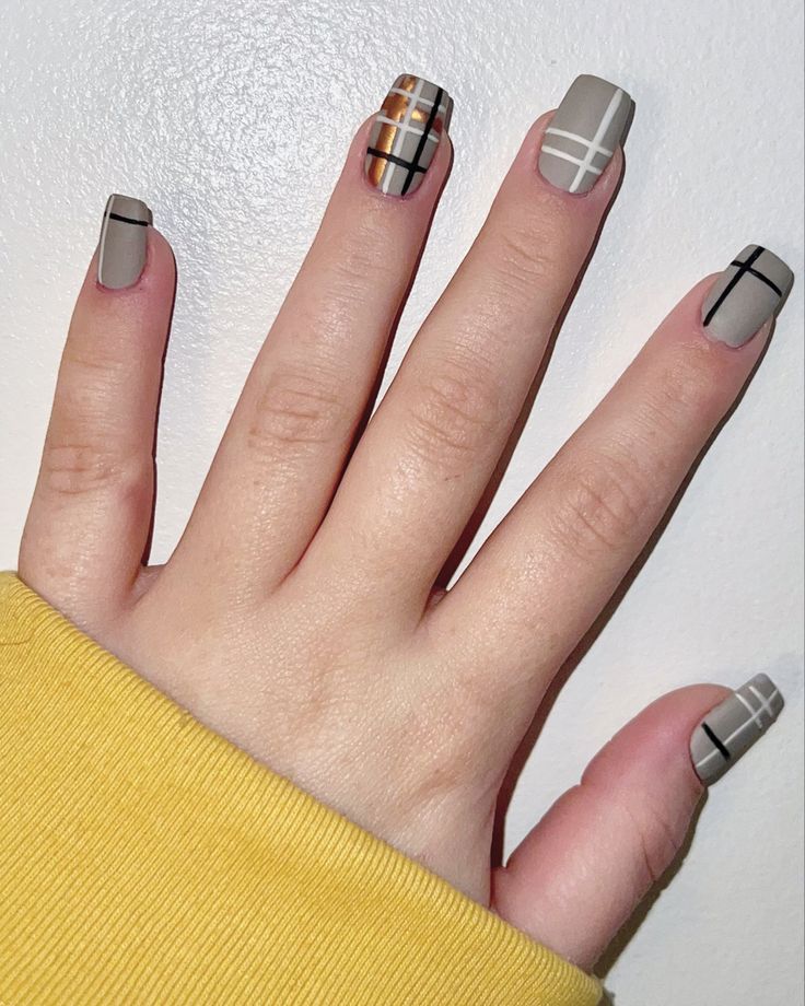 Chic Nail Design with Muted Gray and Geometric Accents for a Sophisticated Look.