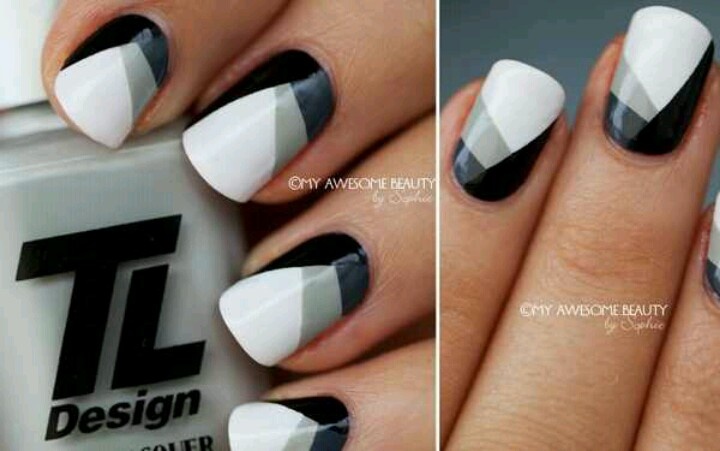 Trendy Geometric Nail Design in Bold Black, White, and Gray Colors.