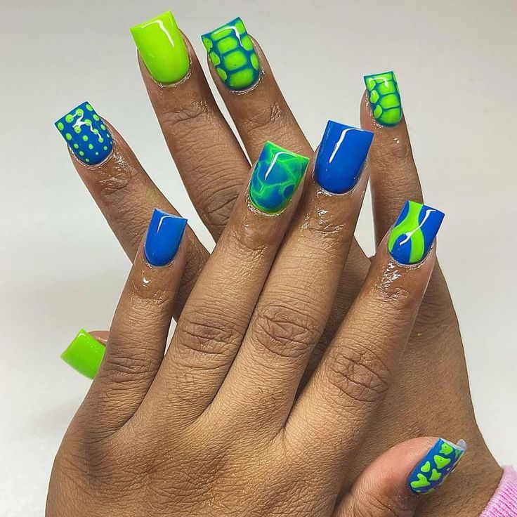 Vibrant Blue and Green Nail Design with Abstract Patterns for a Bold Statement.