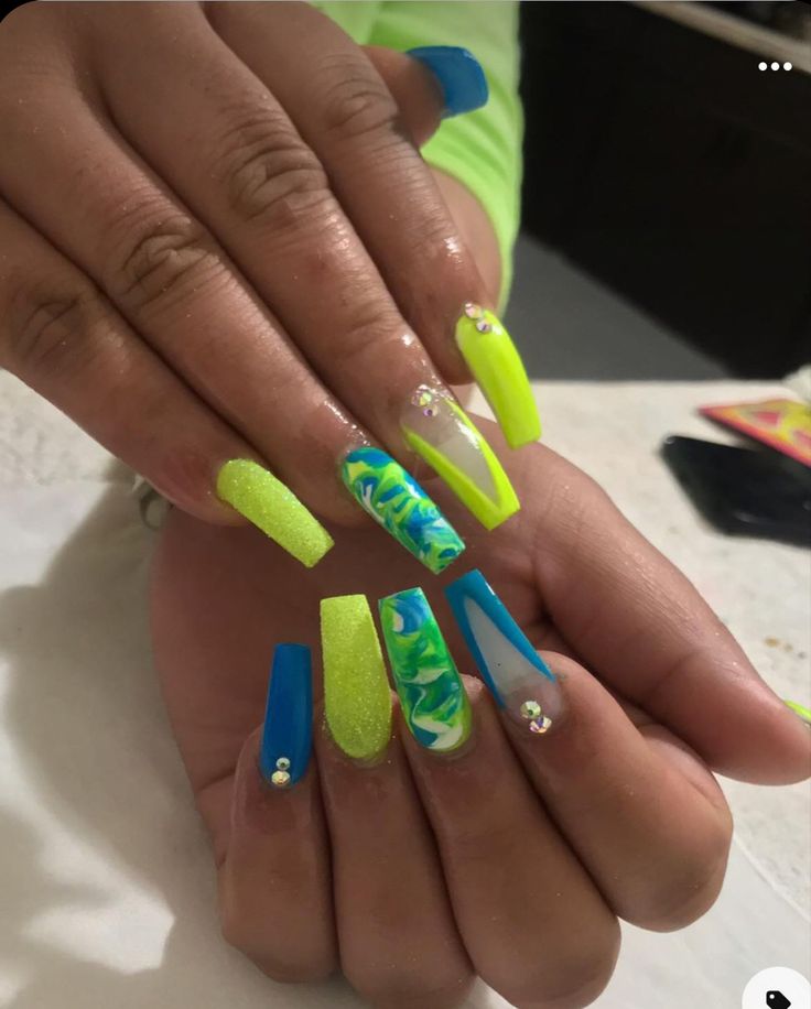 Bold Neon Nail Design with Elongated Shape and Rhinestone Accents