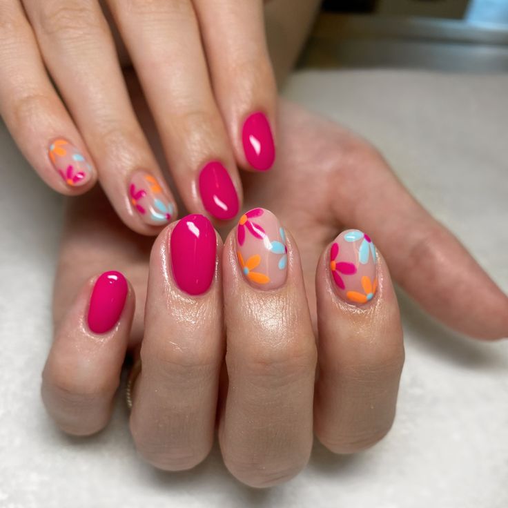 Vibrant Floral Nail Design: A Cheerful Mix of Hot Pink and Playful Pastels.