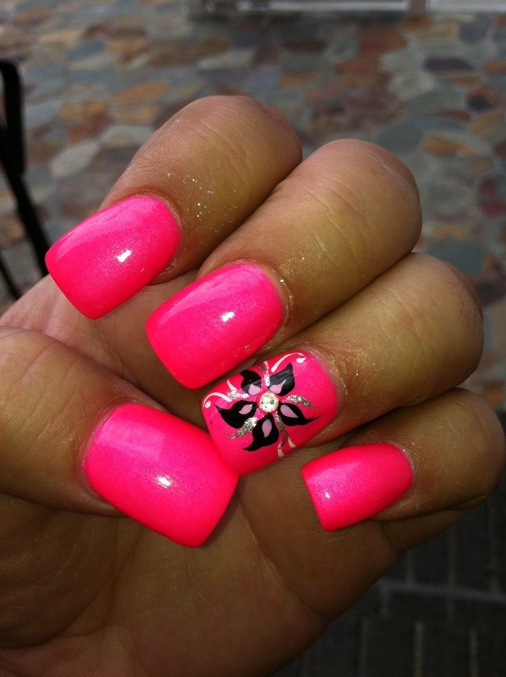 Playful Summer-Inspired Pink Manicure with Floral Accent and Rhinestones