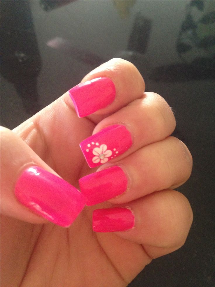 Playful Vibrant Pink Nail Design with Glossy Finish and Charming Floral Accent.