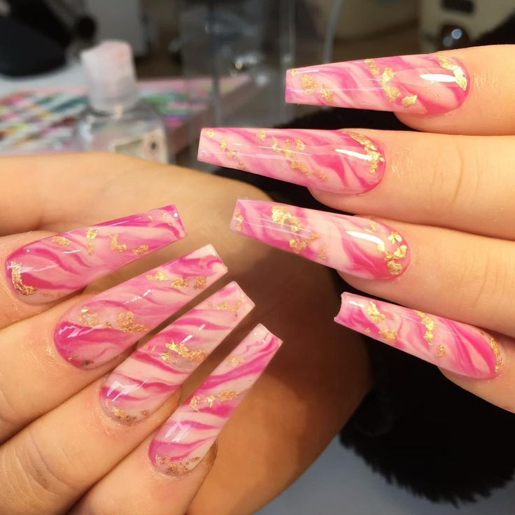 Elegant Vibrant Pink Marble Nail Design with Gold Flakes in Tapered Shape.