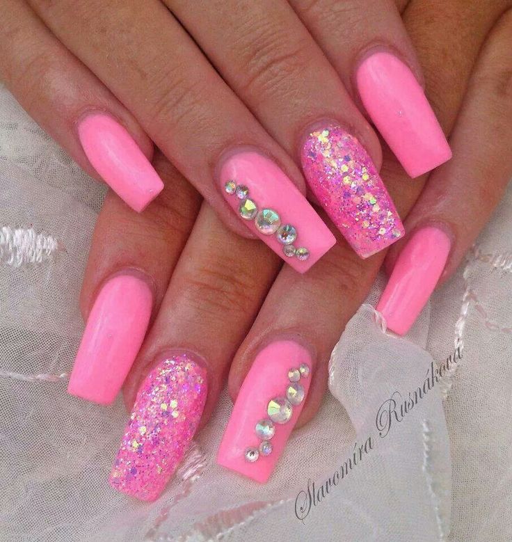 Playful Glamour: Vibrant Pink Nails with Glitter and Rhinestones