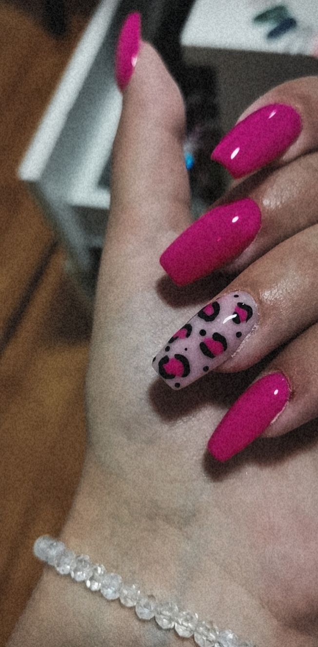 Vibrant Pink Nails With Leopard Print: A Bold and Elegant Statement.