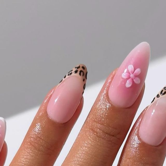 Chic Soft Pink Nail Art with Leopard Print Tips and Floral Accents.