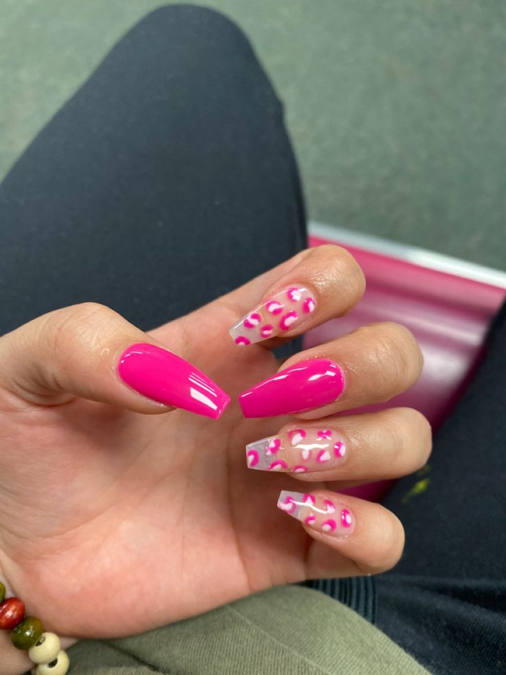 Bold Pink and Leopard Print Tapered Nails: A Trendy Statement Manicure.