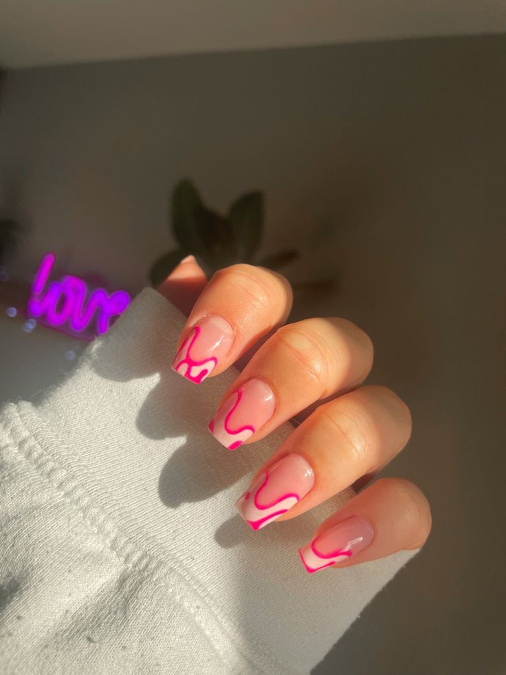 Playful Chic: Bold Pink Drip Accents on Soft Nude Nails