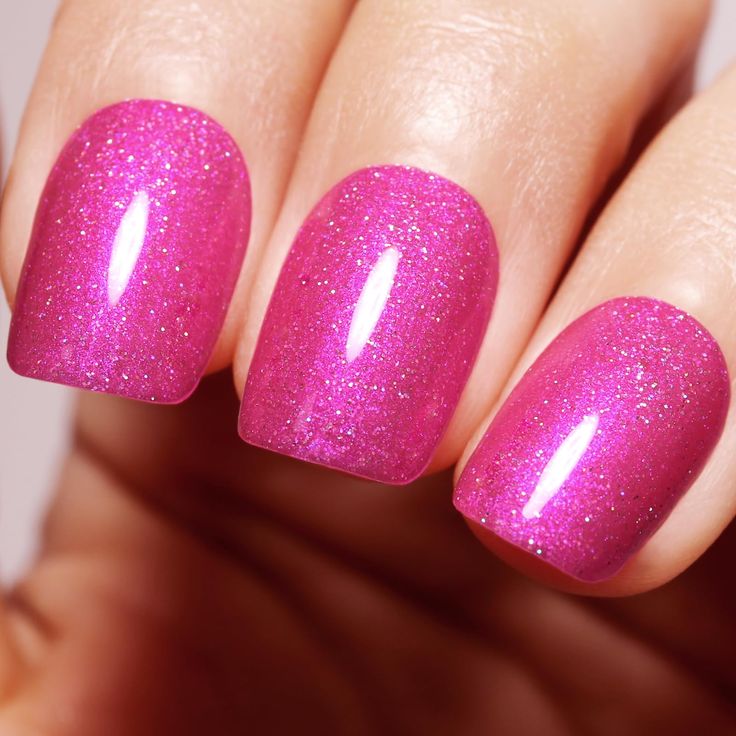 Vibrant Sparkling Pink Nails: A Glamorous and Versatile Choice for Any Occasion.