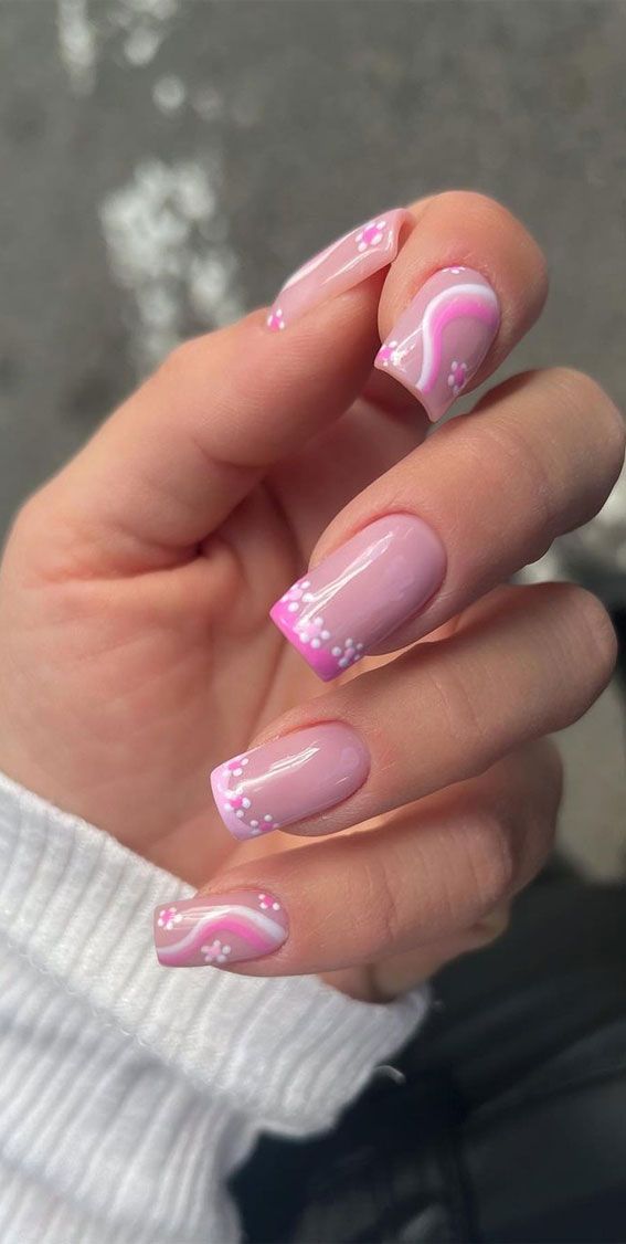 Charming Pink Nail Design with Floral Accents and Elegant Ombre Shading