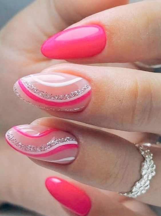 Playful Pink and White Manicure with Glossy Finish and Glitter Accents.