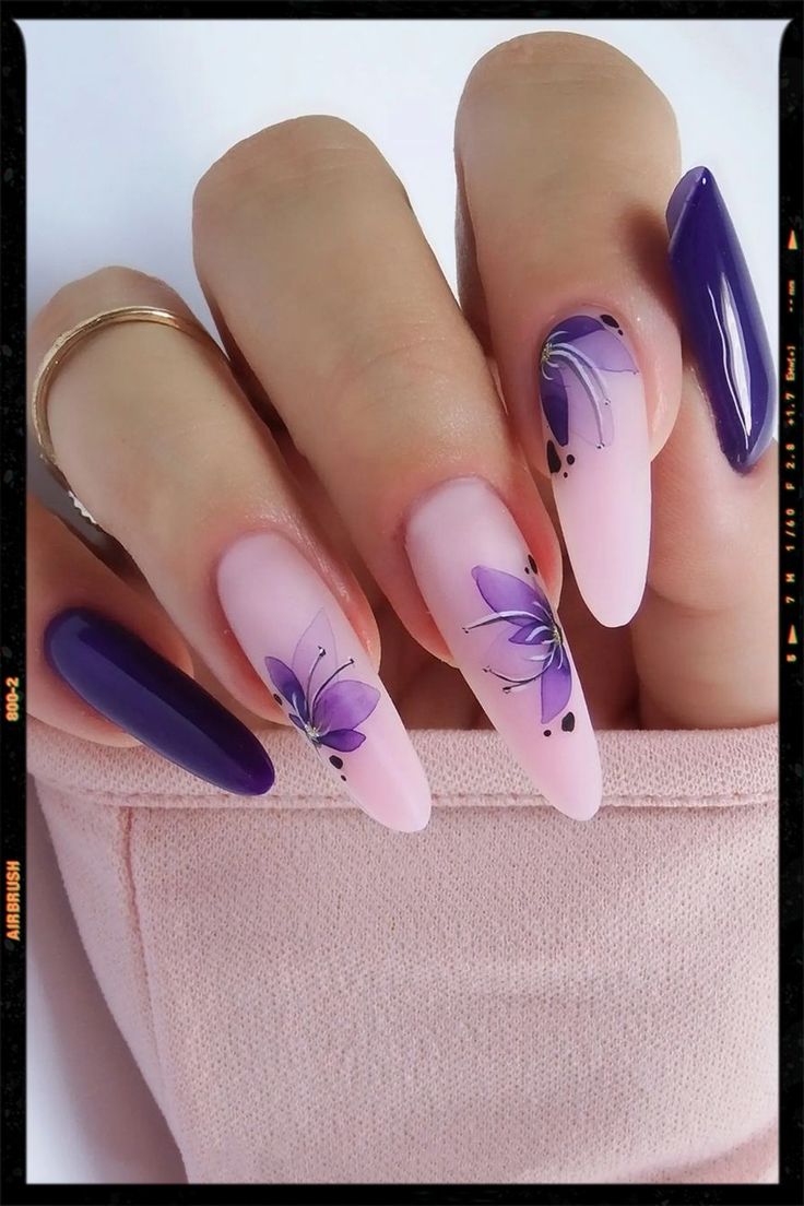 Elegant Floral Nail Design with Purple Flowers and Chic Almond Shape